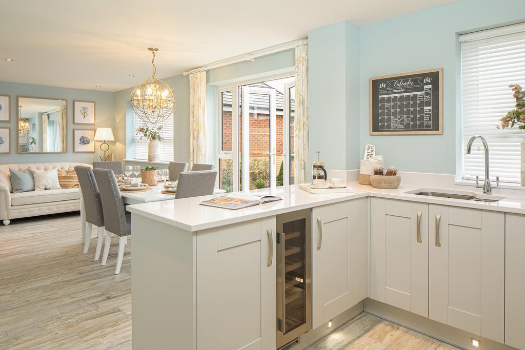 Open plan kitchen with French doors to the...