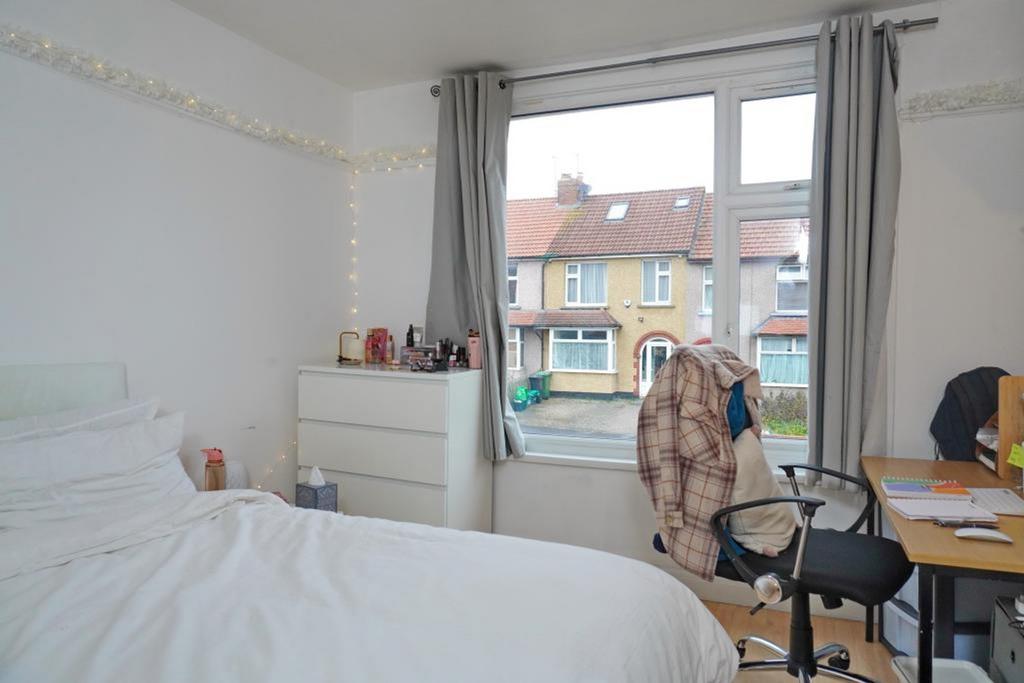 A bright and inviting double bedroom with ample...