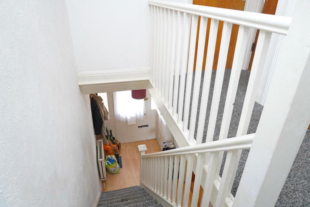 A well-maintained and inviting hallway leading ...