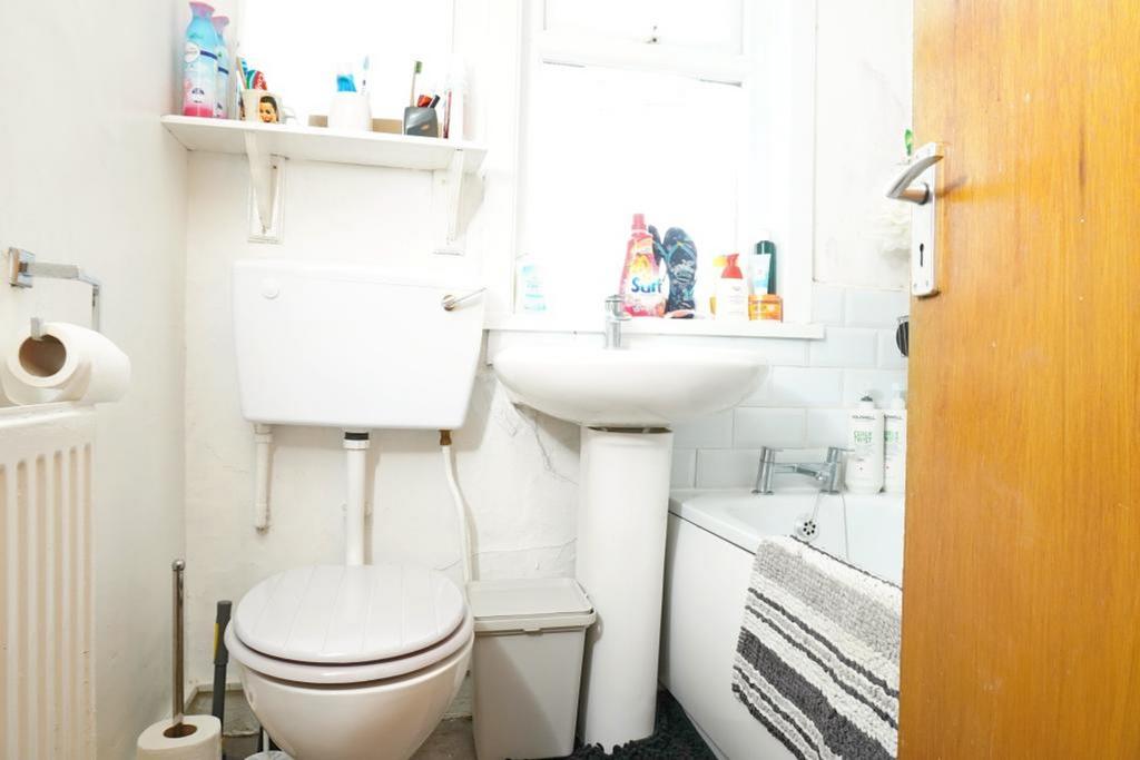 A functional bathroom featuring a bath and natu...