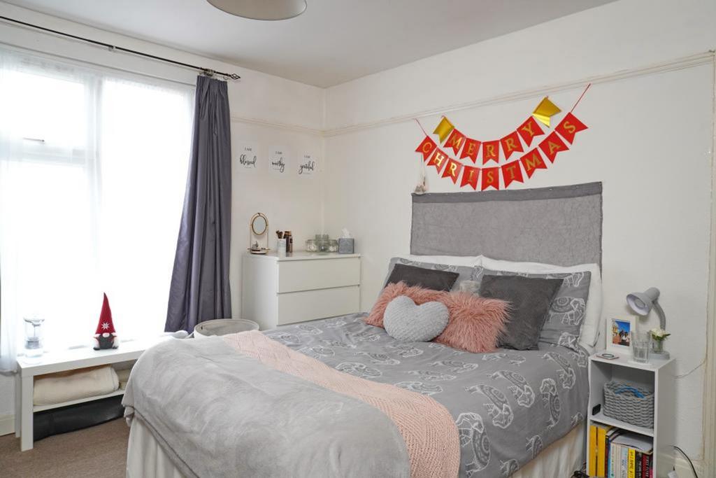 A bright and cozy double bedroom, beautifully d...