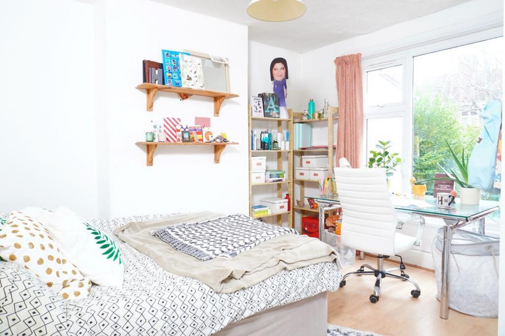 A bright and inviting double bedroom with a coz...