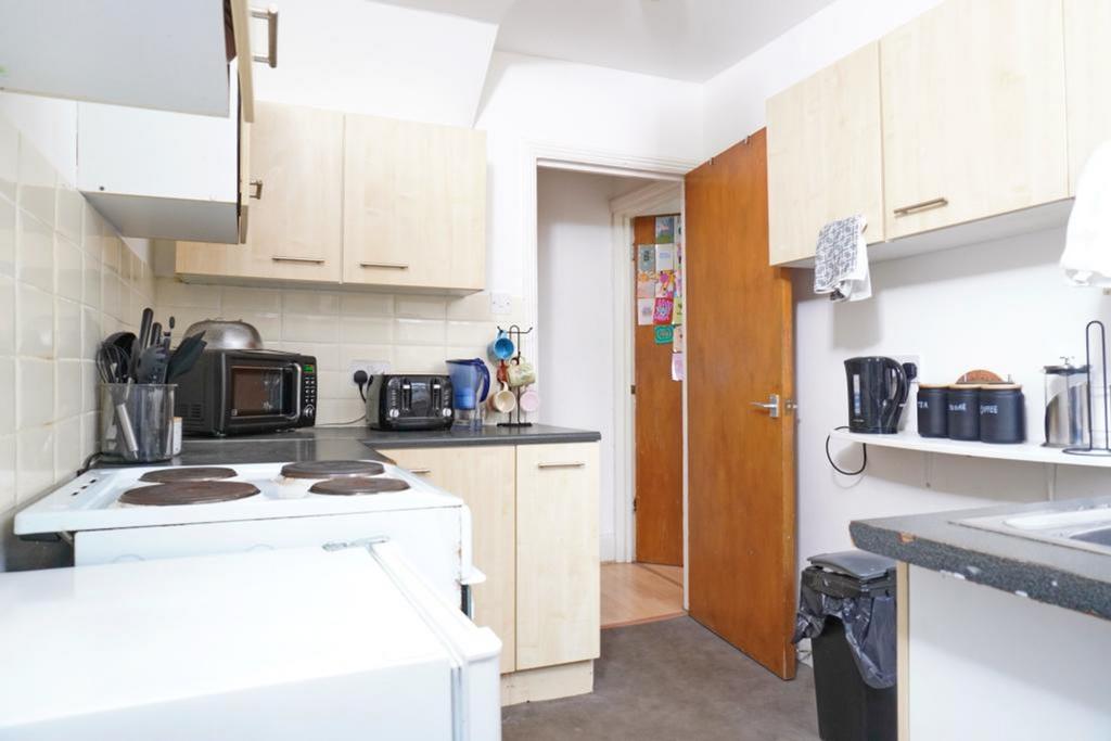 A tidy and functional kitchen equipped with ess...