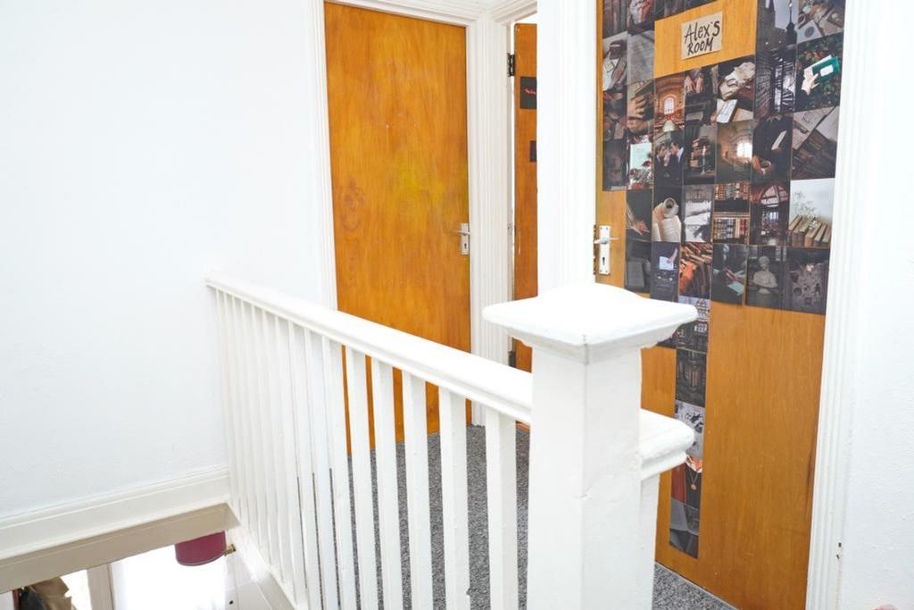 A bright and tidy hallway showcasing a welcomin...