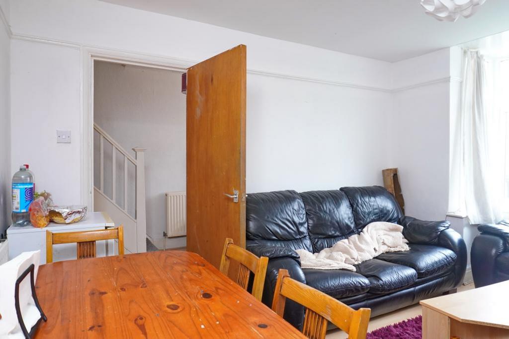 A cozy living room featuring a comfortable sofa...
