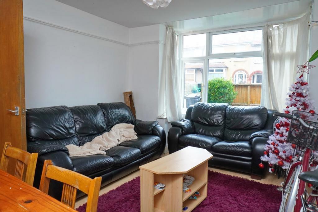 A bright and inviting living room featuring com...