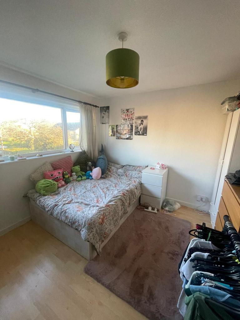 A cozy and well-lit double bedroom, perfect for...