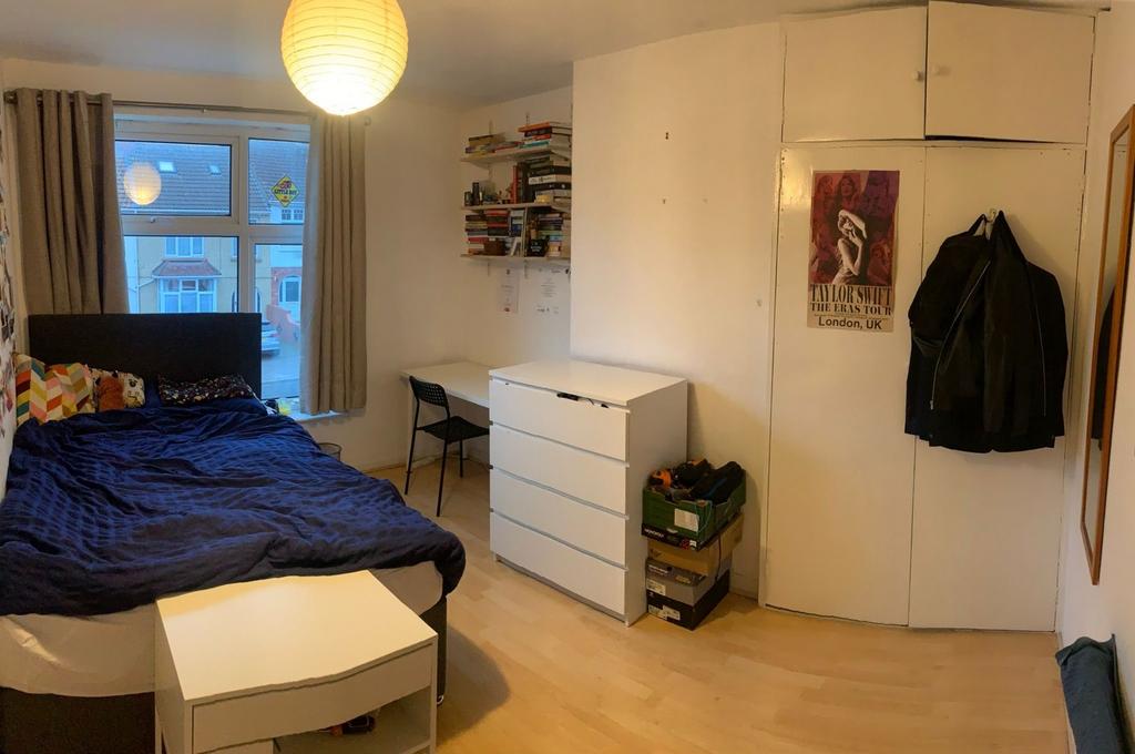 A bright and spacious double bedroom featuring ...