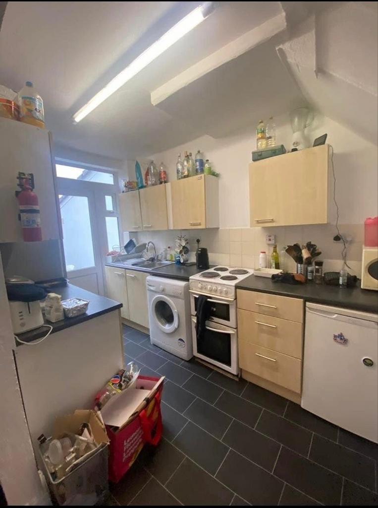 A functional kitchen space with ample storage a...