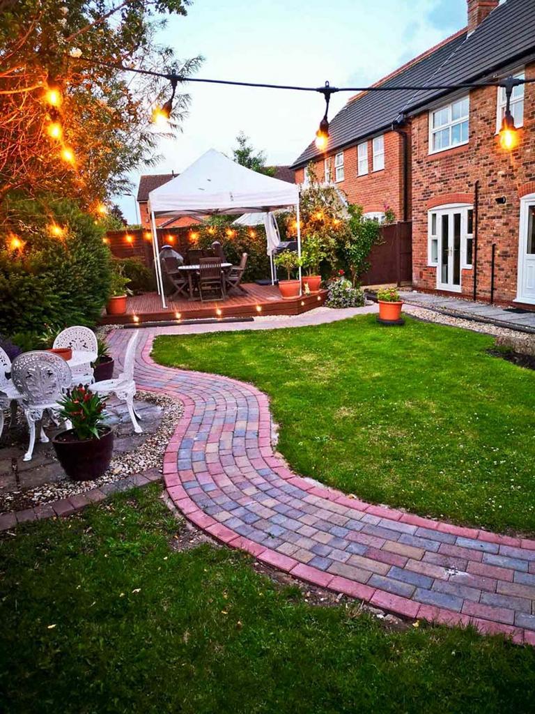 A beautifully landscaped garden with decorative...