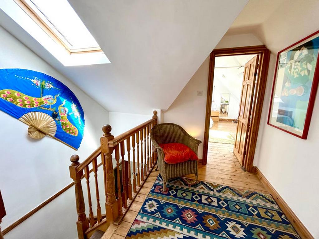 A bright and tidy hallway featuring unique deco...