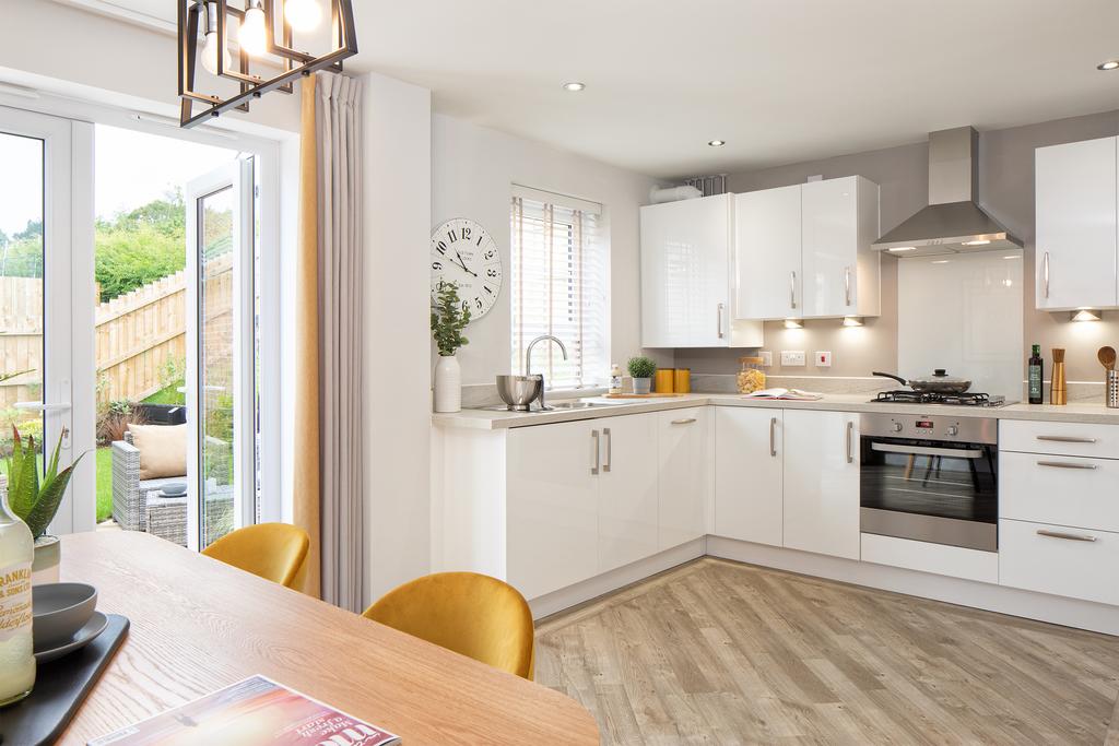 Open plan kitchen with French doors to the...