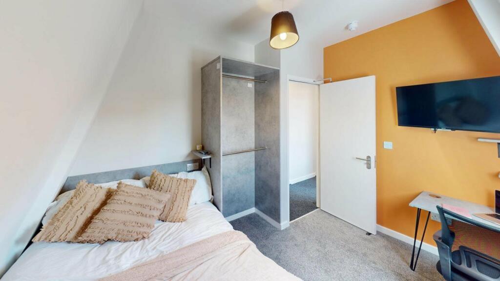 A stylish and inviting double bedroom featuring...