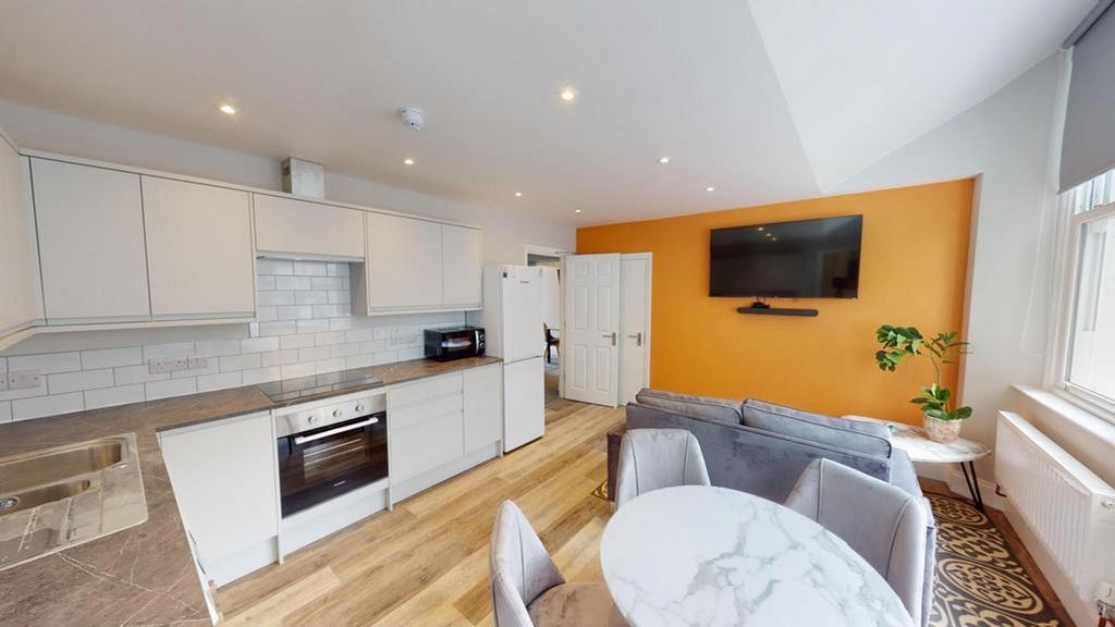 A modern and bright kitchenette area with ample...