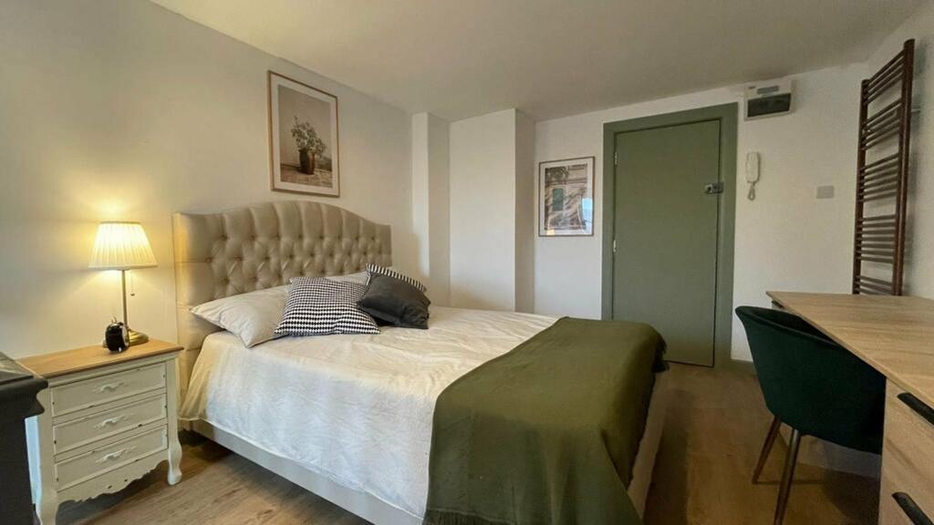 A bright and inviting double bedroom featuring ...