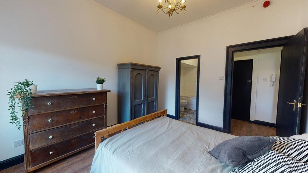 A spacious and inviting double bedroom featurin...