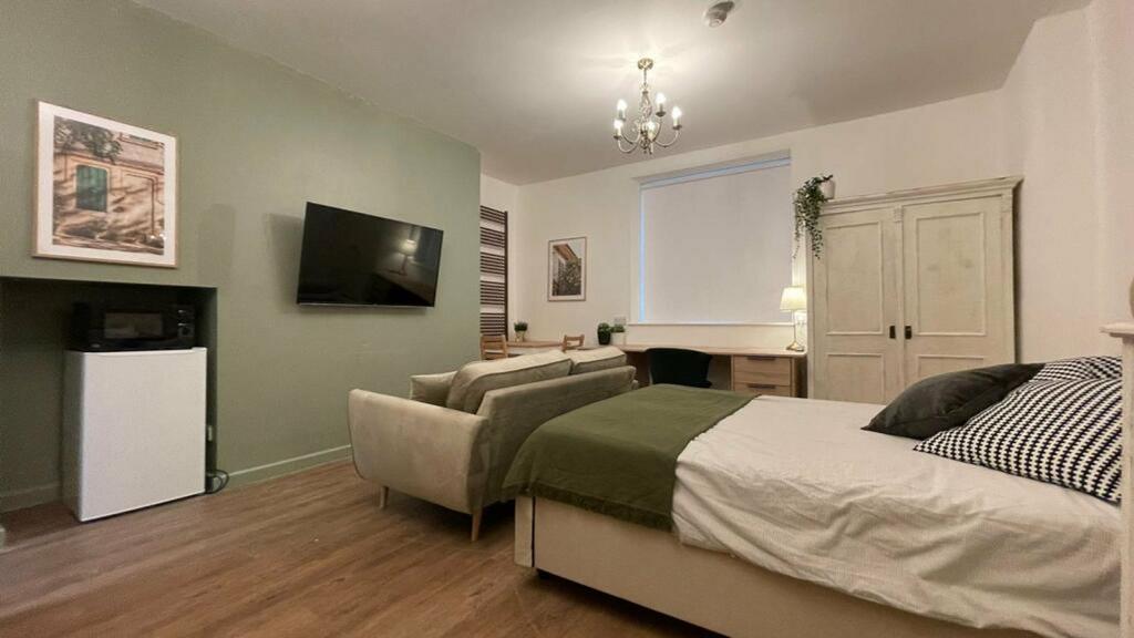 A spacious and stylish large double bedroom fea...