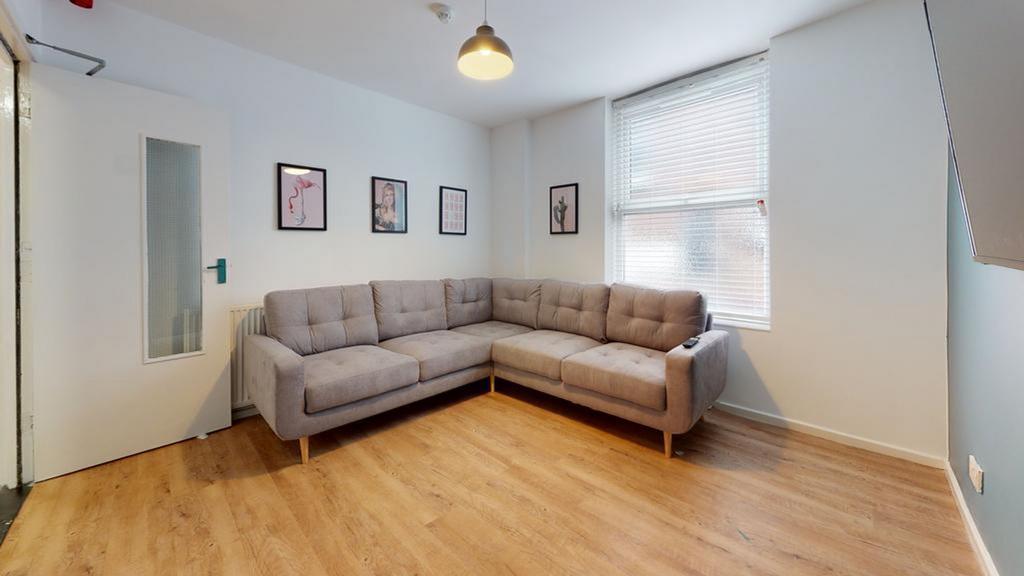 A bright and inviting living room with comforta...