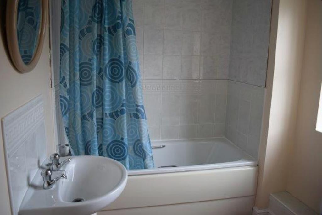 A tidy and well-maintained bathroom featuring a...