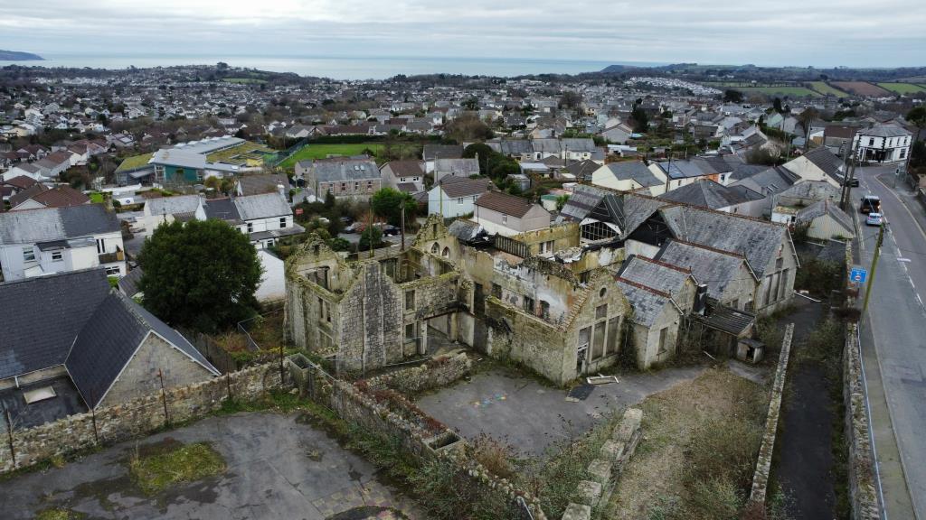 Aerial photo showing buildings and sea in the back