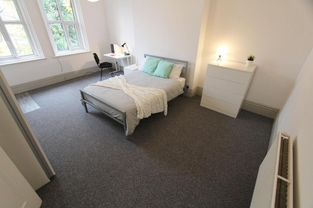 A spacious and inviting large double bedroom, p...