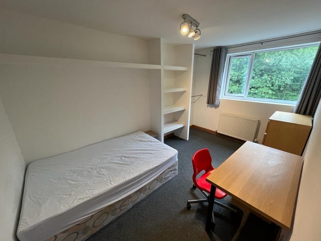 A bright and spacious double bedroom featuring ...