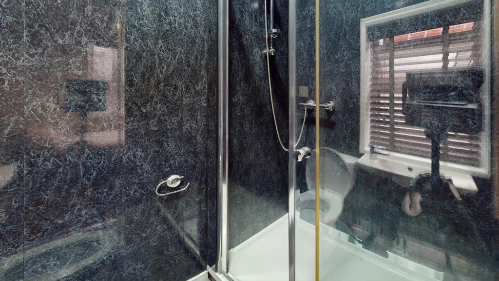 A modern and stylish bathroom featuring a sleek...