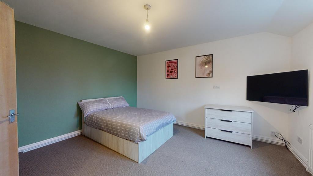 A spacious and well lit double bedroom, perfect...