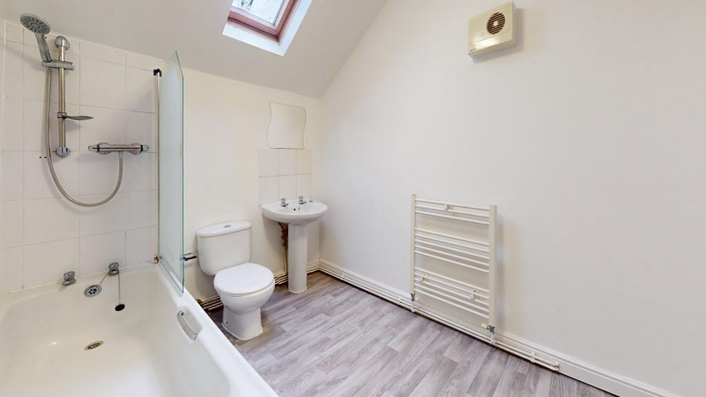 A spacious and bright large bathroom featuring ...