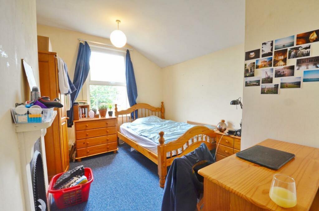 A cozy double bedroom featuring ample storage a...