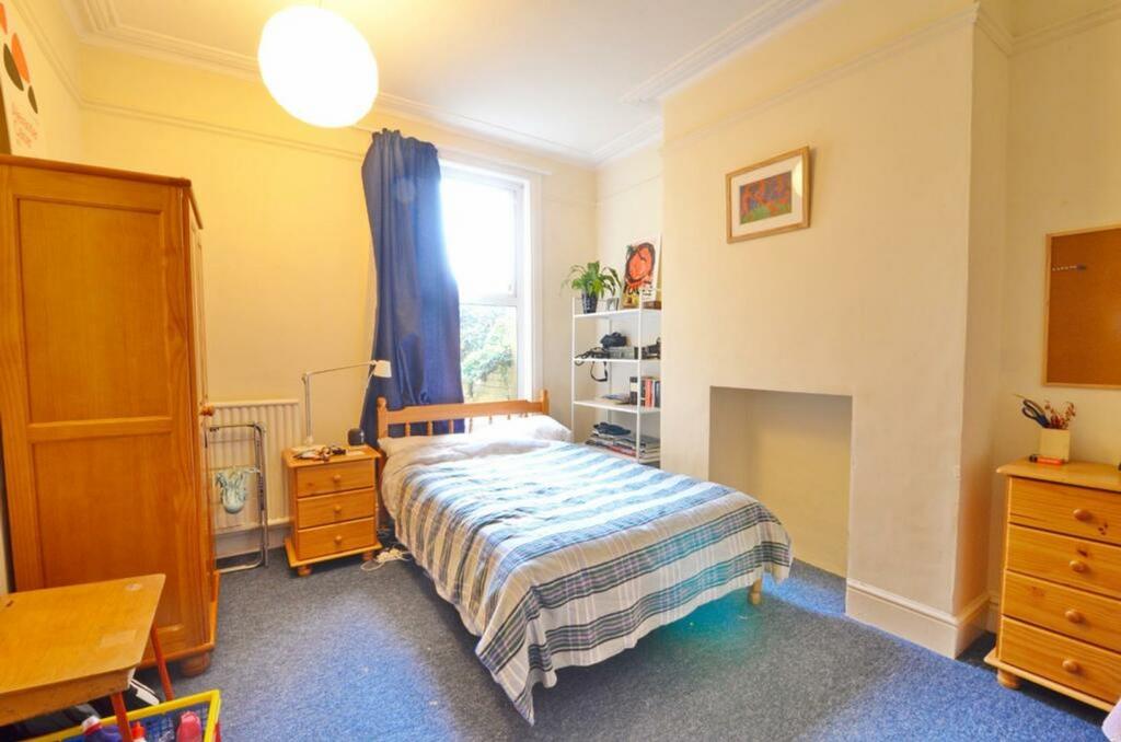 A bright and inviting double bedroom featuring ...