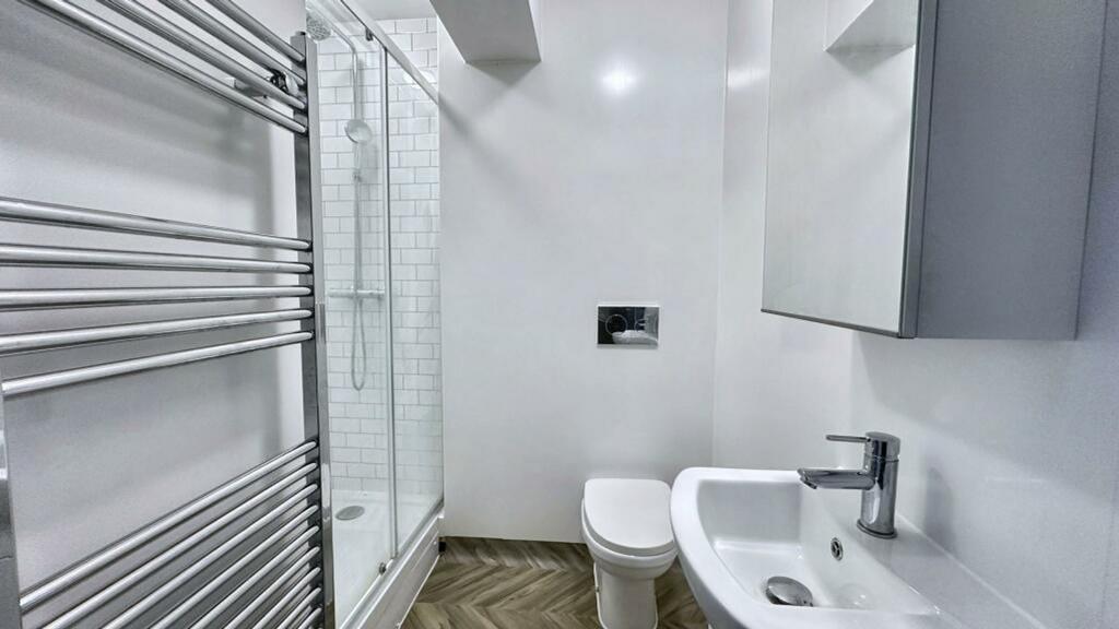 A modern and stylish bathroom featuring a sleek...