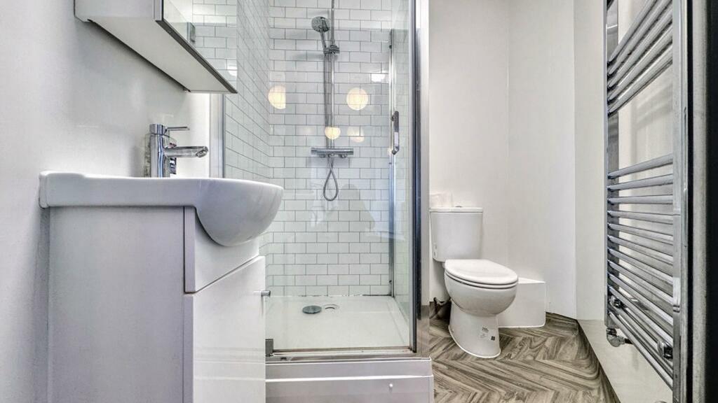 A bright and modern bathroom featuring a spacio...