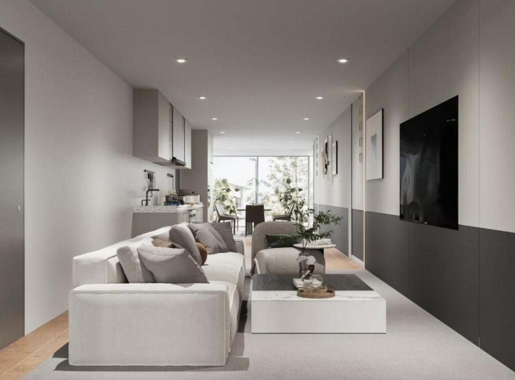 A spacious and stylish modern living room fille...