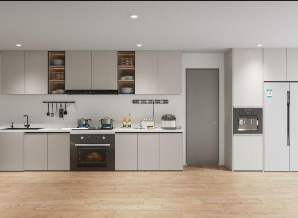 A modern and spacious kitchen equipped with sty...