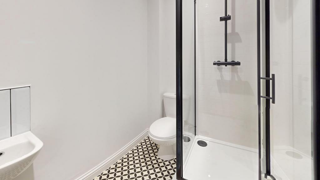 A modern and well-maintained bathroom featuring...