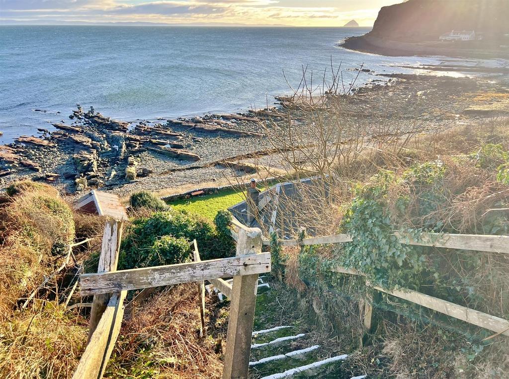 Steps down to Shore Cottage