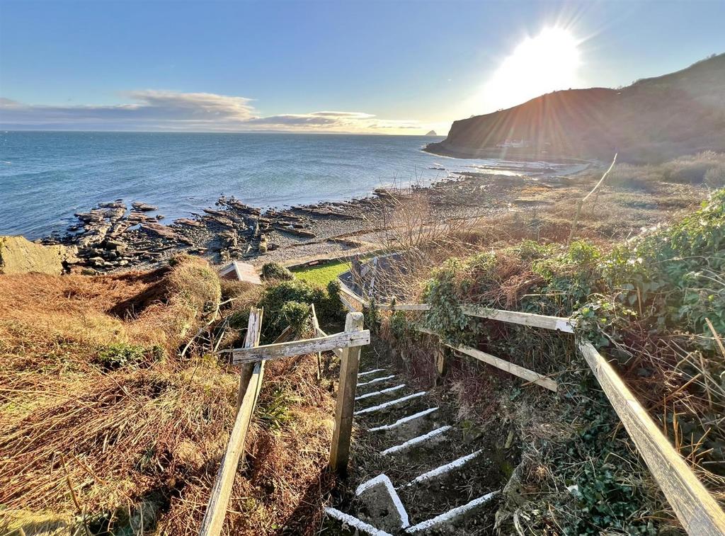 Steps down to Shore Cottage