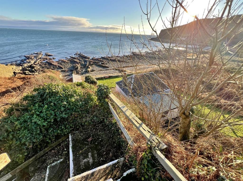 Steps down to Shore Cottage