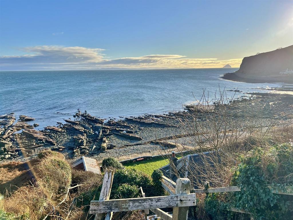 Steps down to shore cottage