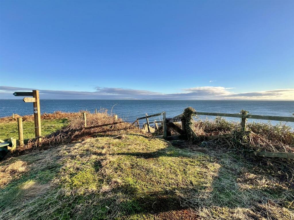 Gate to Shore Cottage and steps down