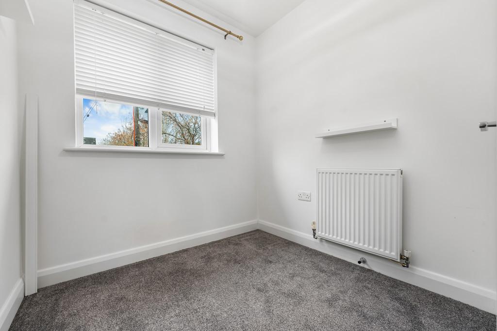 Small bedroom with shelf