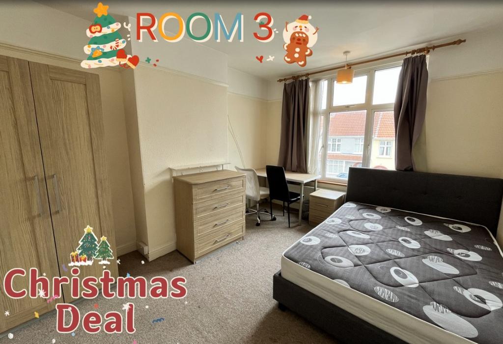 A bright and spacious double bedroom featuring ...