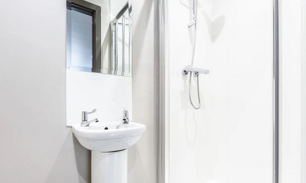 Bright and neat bathroom featuring a modern ped...