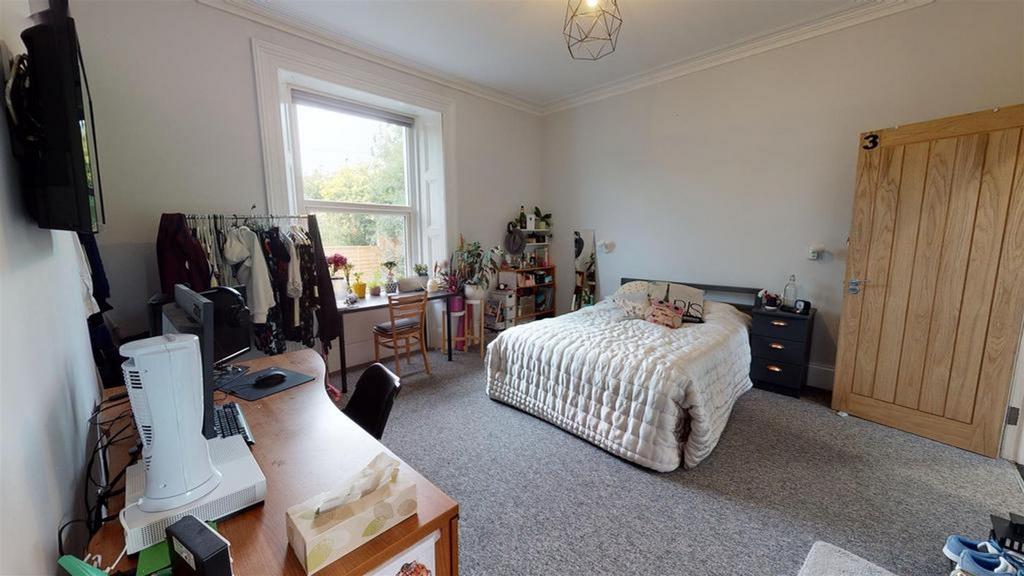 A spacious and well-lit large double bedroom, p...