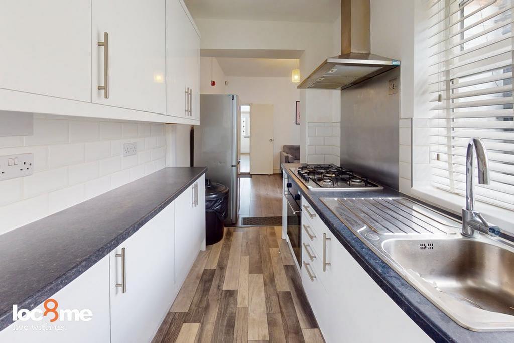 A bright and modern kitchenette featuring ample...