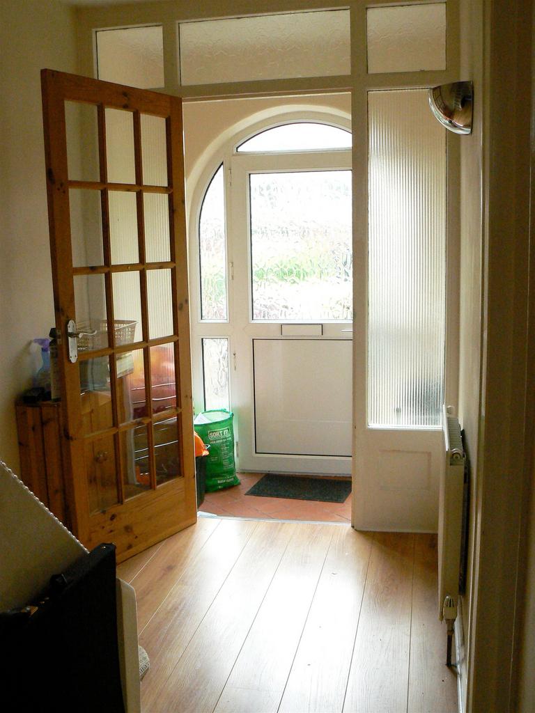 A bright and welcoming hallway with natural lig...