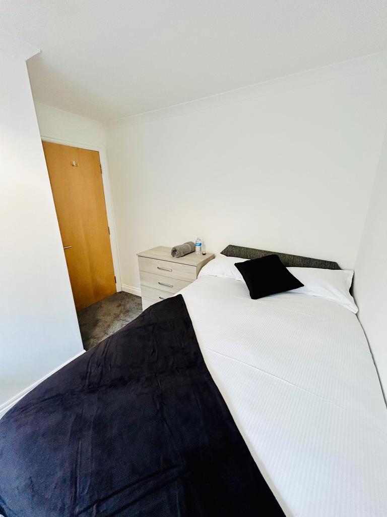 A spacious and inviting double bedroom, perfect...