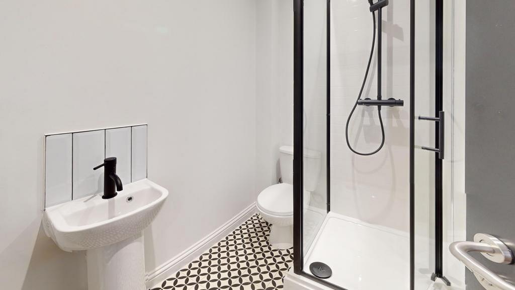 A modern and stylish bathroom featuring a sleek...