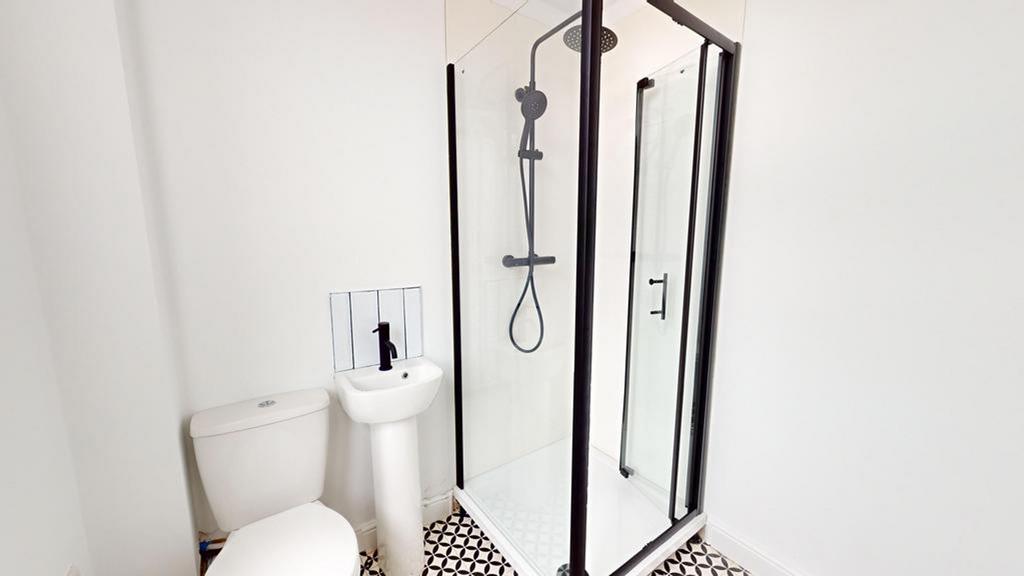 A modern and clean bathroom featuring a stylish...